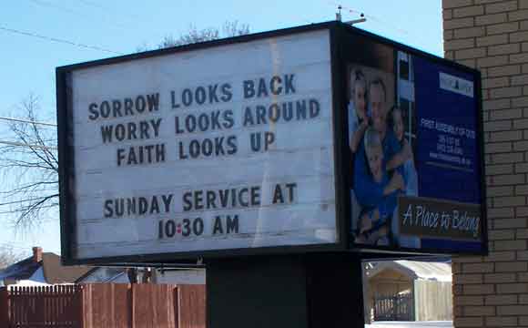 Words on a church sign: SORROW LOOKS BACK / WORRY LOOKS AROUND / FAITH LOOKS UP